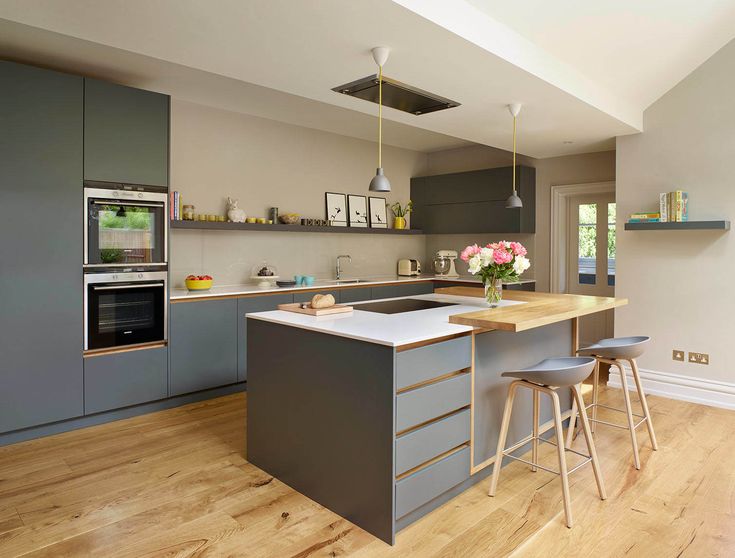 Modern kitchen with high-quality particle board cabinets and a large white island