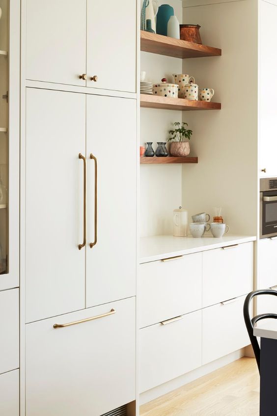 flat pannel cabinets with brush brass pulls european charm
