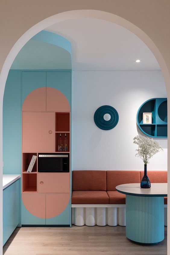 mint green walls and round furniture complete apartment interior in vietnam