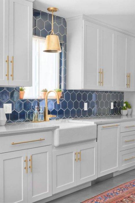 White kitchen cabinet with bule backsplash