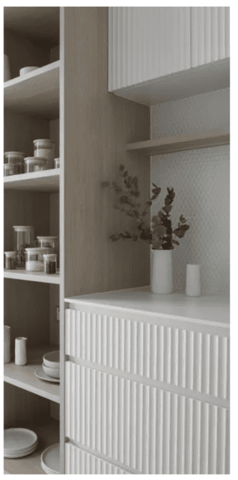 Fluted door and drawer fronts lend a sense of sophistication