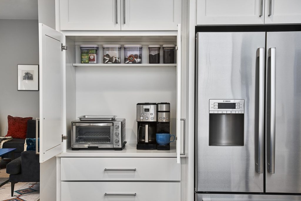 modern kitchen cabinet organization with utensil dividers and appliance garage