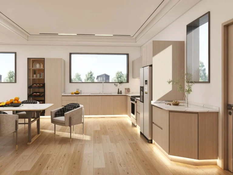 A sleek, modern kitchen with light wood kitchen cabinets featuring a melamine finish. The spacious layout integrates natural tones, a dining area, and ample storage for a functional yet elegant design.