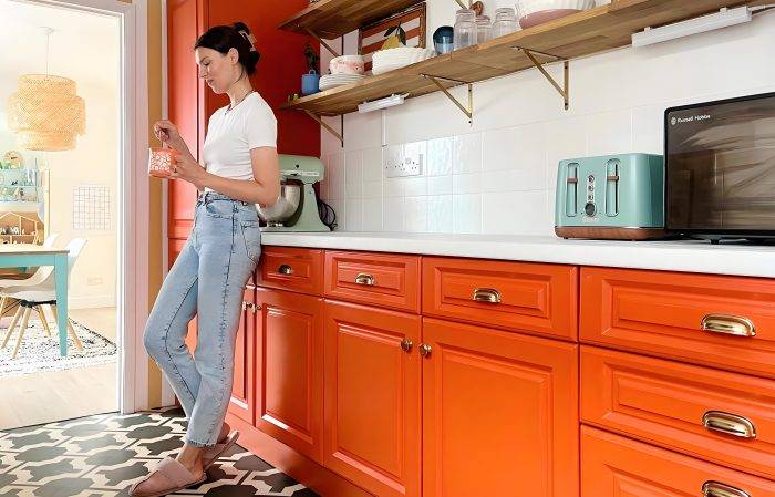 PA Home bright orange cabinets for a lively kitchen