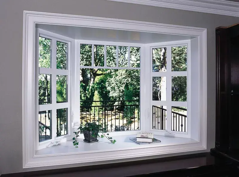 Large bay and bow aluminum windows extending outward, creating a cozy reading nook.