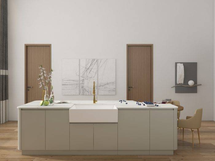 Greige kitchen cabinets with a farmhouse sink, white marble countertops, and gold faucet in a modern farmhouse design