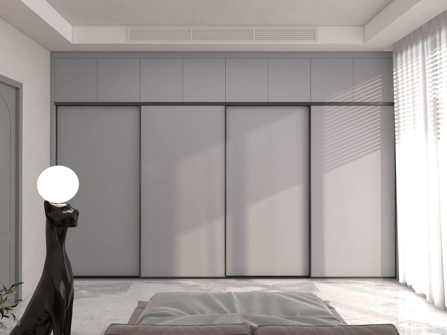 Sliding door wardrobe in a modern bedroom with neutral tones