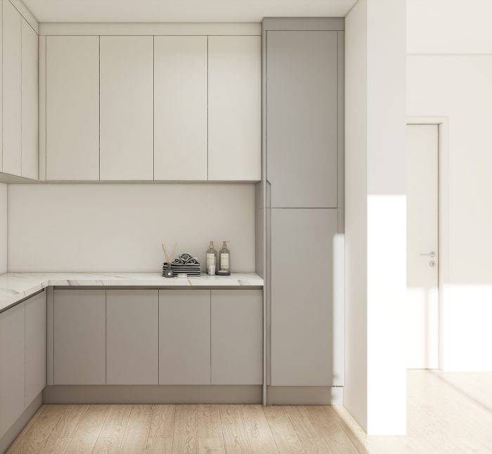 Compact kitchen with greige kitchen cabinets, white countertops, and natural light for a bright, space-saving design