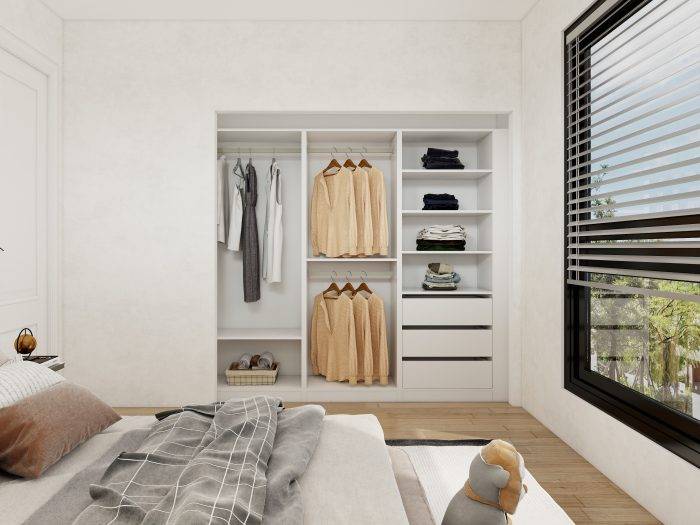 Modern wardrobe design for bedroom with mirror panels reflecting the room