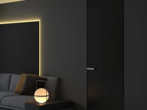 Modern black invisible interior door with a seamless flush design, featuring a sleek handle and integrated into a minimalist dark-toned living space.