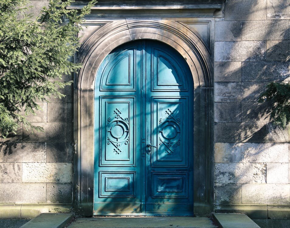 blue color wooden arched front door