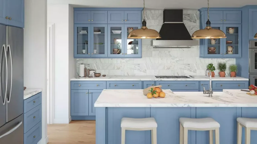 7 Tips to Choose The Best Kitchen Rta Cabinets For Your Project 1 A modern kitchen with blue shaker-style RTA cabinets and a marble countertop