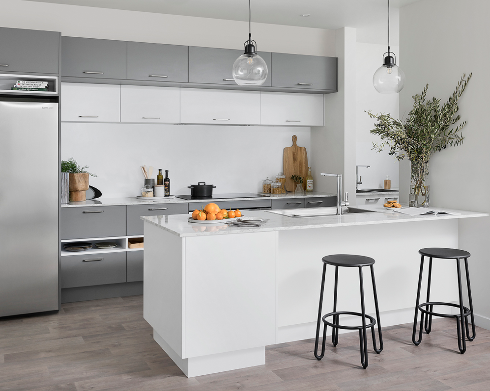 Modern kitchen with gray and white RTA cabinets and island