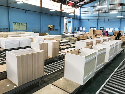 RTA kitchen cabinets being assembled in a warehouse for wholesale supply