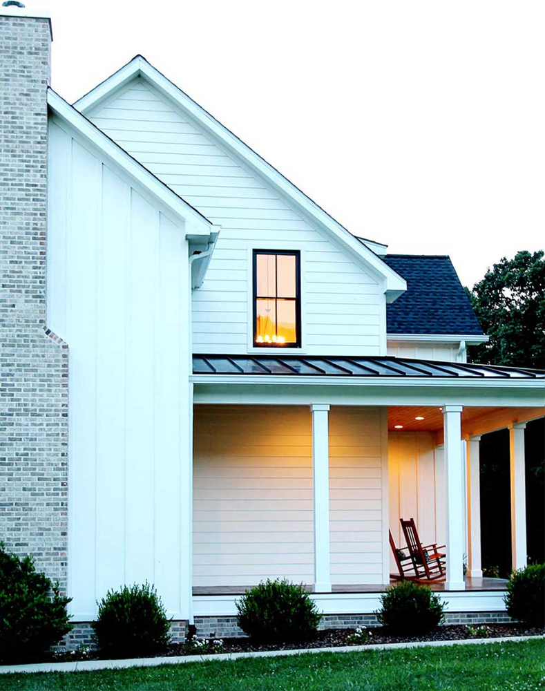 modern framhouse style home with black vinyl window