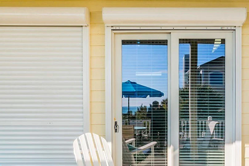 white-vinyl-window-with-shutters