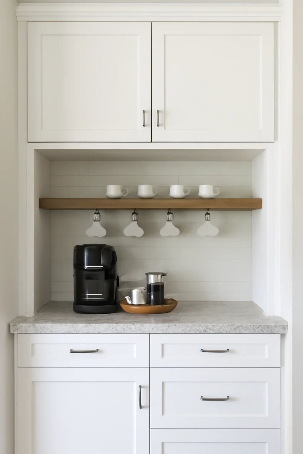 built-in coffee bar cabinet with a coffee maker, hanging mugs, and sleek design.