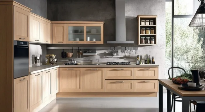 Maple kitchen cabinets with modern design in bright spacious kitchen featuring natural light and sleek appliances.
