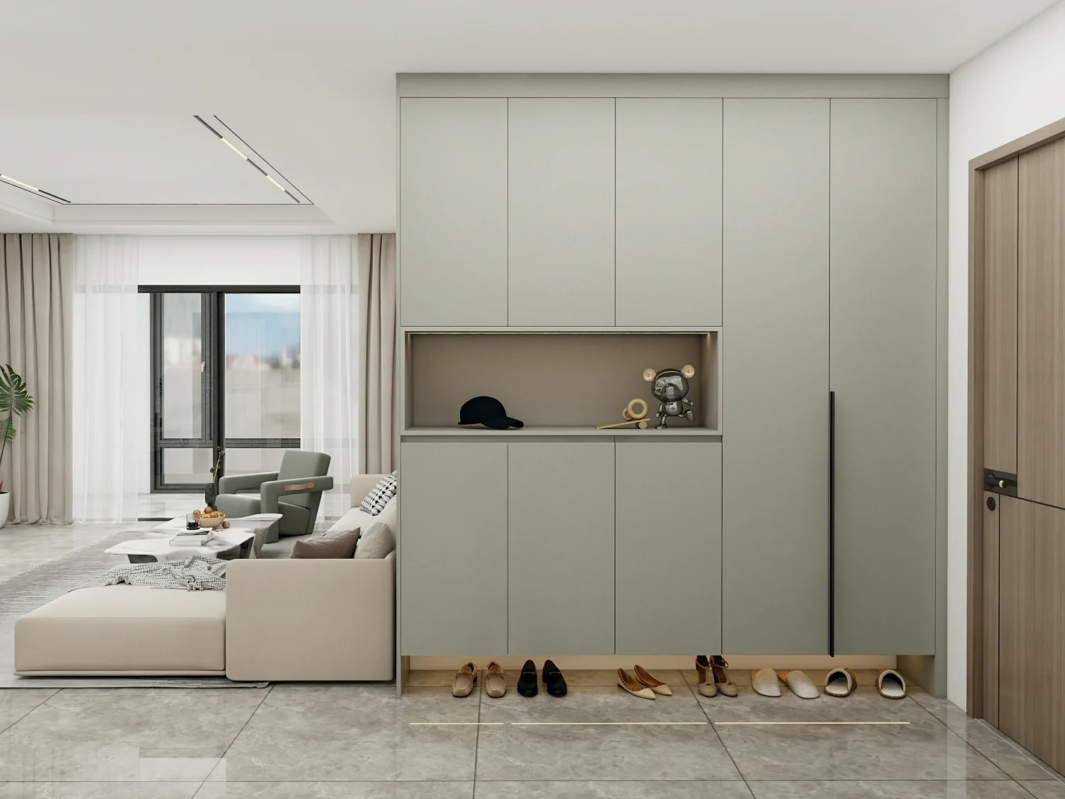 Modern shoe cabinet entryway with green-gray finish, open bottom storage, adjacent to living room seating area.