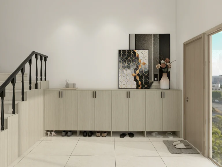 Contemporary shoe cabinet entryway under staircase with closed storage, artwork, and accents on tiled floor.