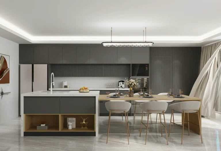 A modern kitchen showcasing light laminate cabinets and a spacious island countertop.