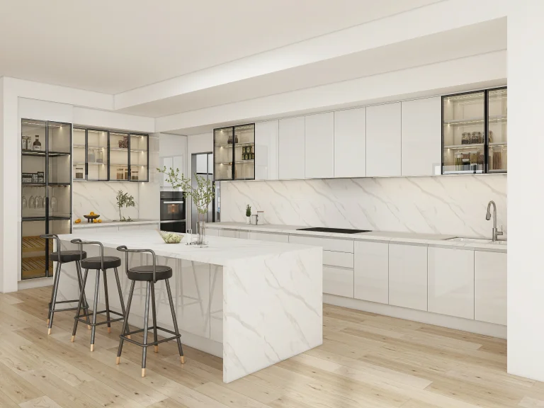 A modern modular kitchen with white cabinets, marble island, and black metal bar stools.