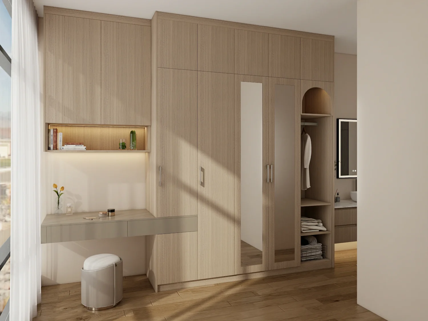 Bedroom wardrobe designs in soft beige wood with arched niche, mirrors, desk, and a warm lighted shelf.
