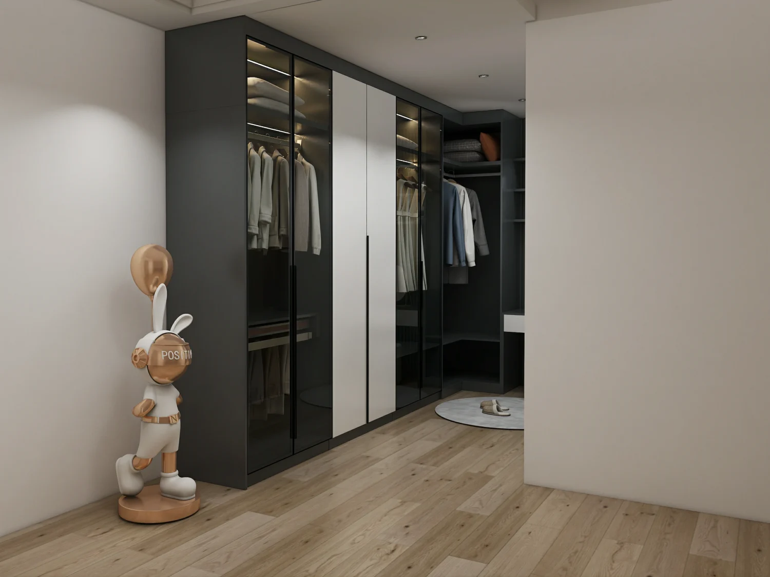 Bedroom wardrobe closet with glass doors and soft LED lighting displaying neatly arranged clothes beautifully.