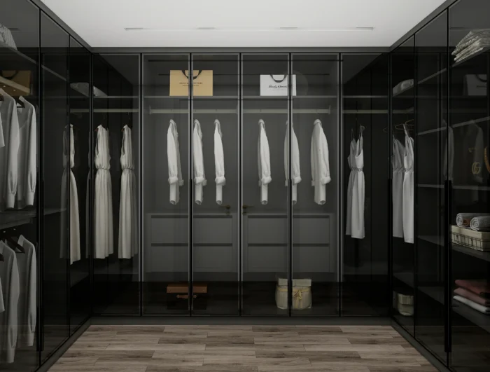 A black wardrobe placed in a master bedroom, offering a sophisticated and bold storage solution.