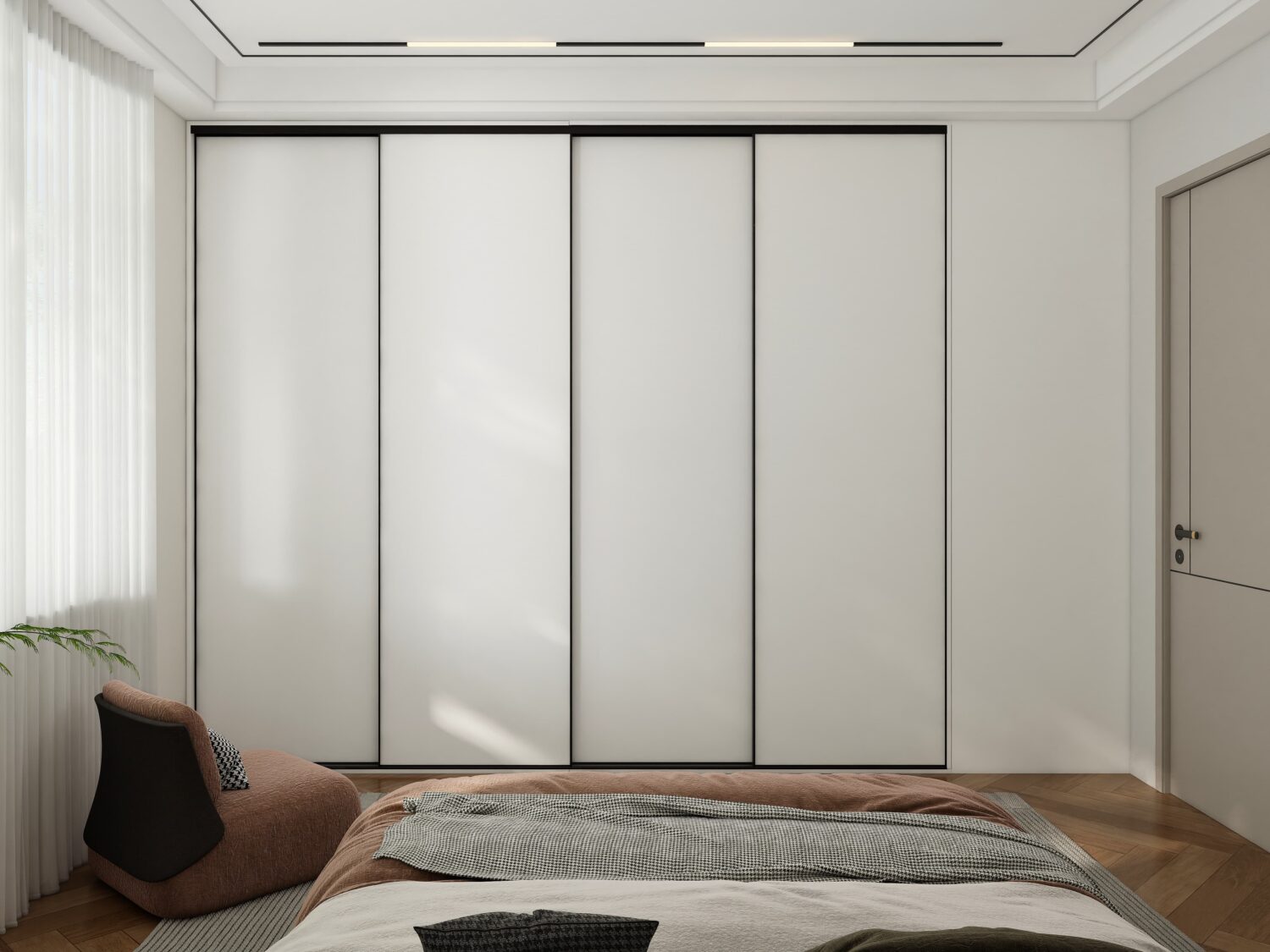 Sleek modern bedroom featuring a built-in white sliding wardrobe with black frames, soft textures, and natural light.