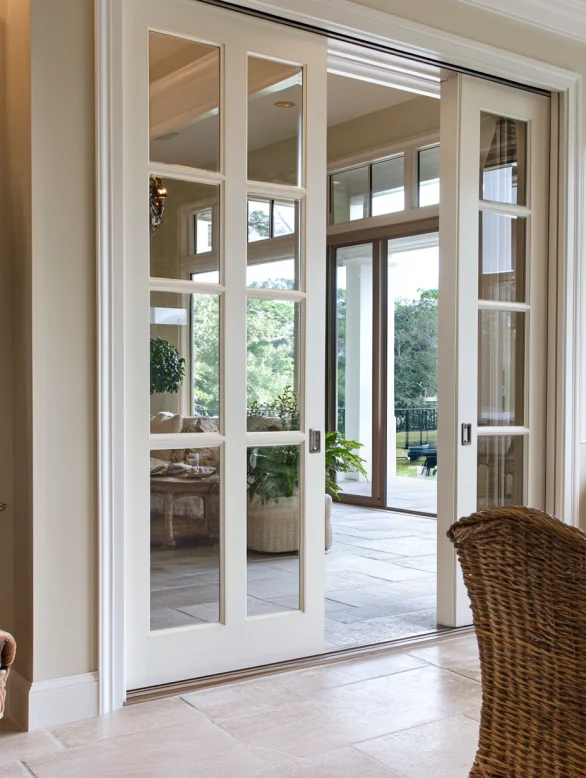 sliding glass modern interior door with multiple panes connecting indoor and outdoor space
