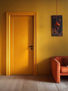 Bright yellow interior door in a lively, warm room with vibrant décor.