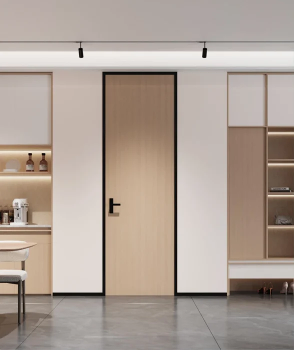 light wood modern interior door with black frame detail in minimalist kitchen living area
