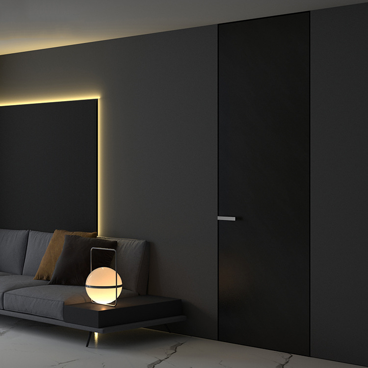 Black wooden interior door with sleek minimalist design next to gray sofa and accent lighting.