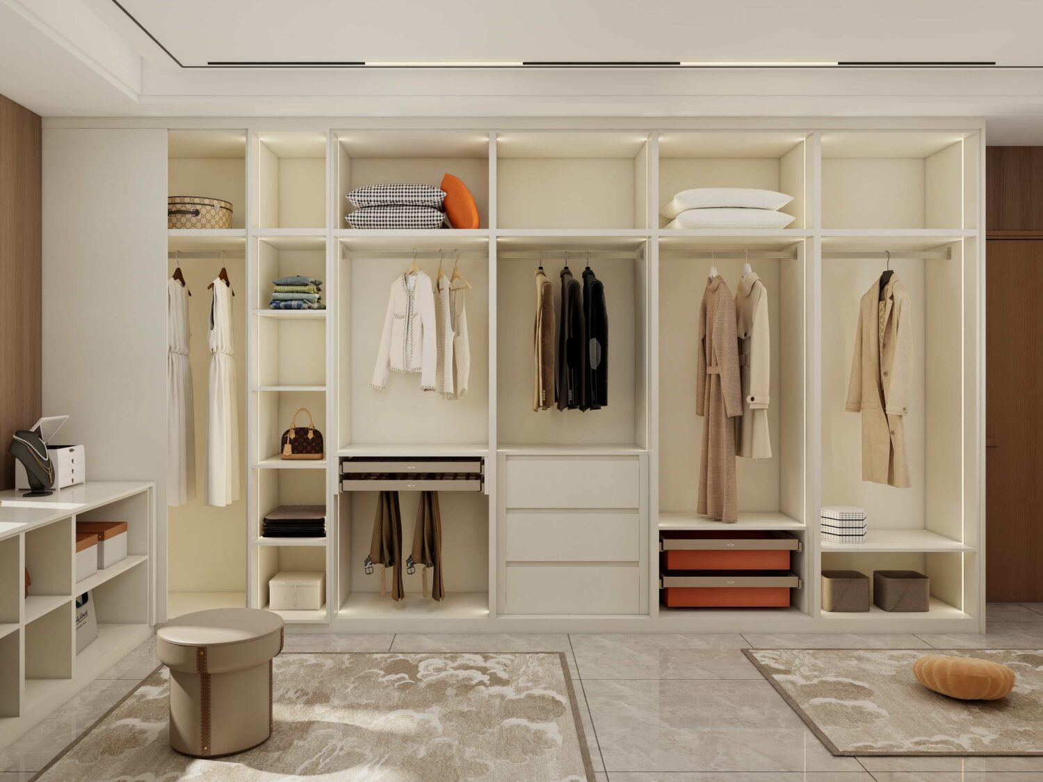 Spacious custom walk-in wardrobe with hanging space, drawers, shelves, and light neutral finish for organized storage.