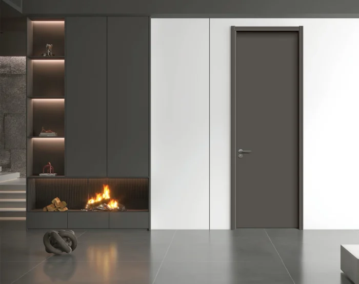 Dark modern interior door next to built-in fireplace showing standard interior door dimensions.