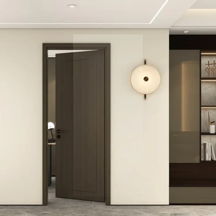 Wooden custom interior door in a modern home with warm neutral tones and soft lighting.