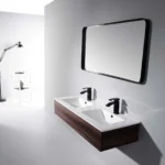 Contemporary double sink vanity with black faucets and wooden base featuring a sleek mirror