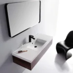 Stylish wall mounted sink vanity with black faucet and minimalist design