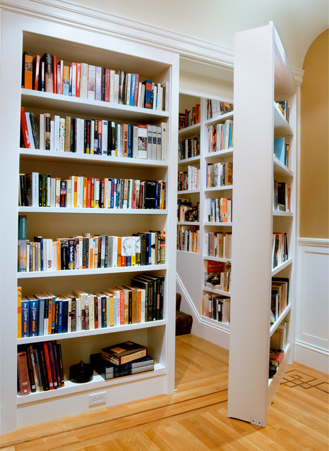 Bookshelf door that opens to a hidden room, designed to blend with the shelves.