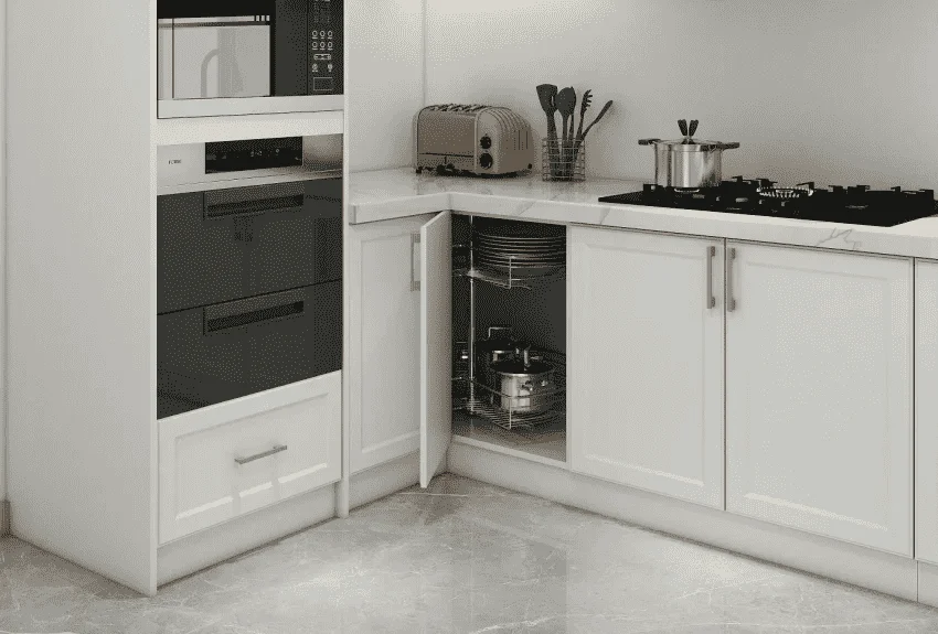 Corner base cabinet with lazy susan shelves maximizing storage in compact kitchen spaces.
