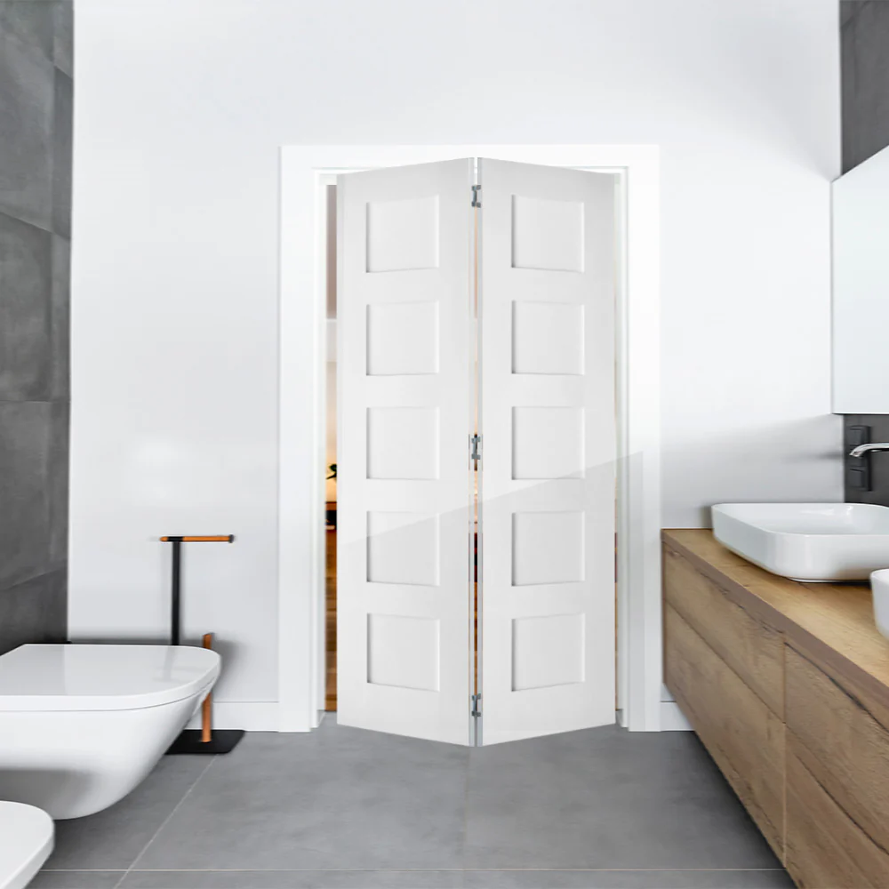 A compact bifold bathroom door folding neatly to save space inside a small contemporary bathroom.