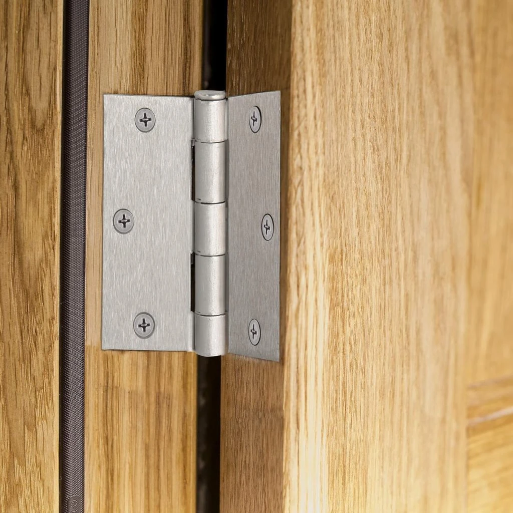 Butt hinge used for traditional rustic cabinet doors, visible when closed.
